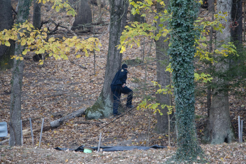 Police officers continue to search the Grandin Road area in the vicinity of Patrick Henry High School, Thursday, Nov. 14, 2019, in Roanoke, Va., for Michael Alexander Brown, a Marine deserter wanted for questioning in a murder case. (Stephanie Klein-Davis/The Roanoke Times via AP)