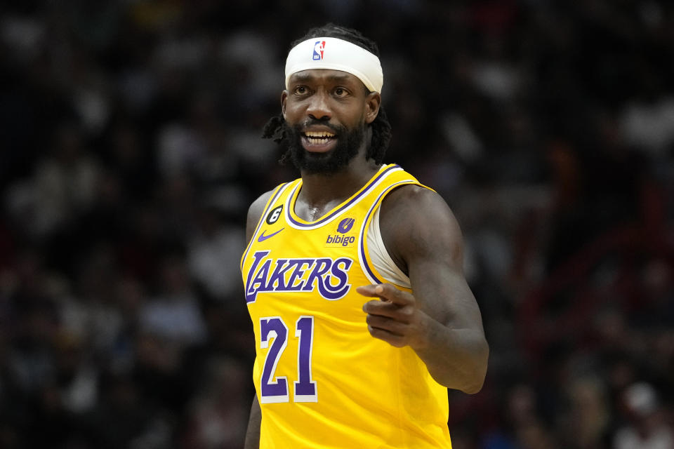 Los Angeles Lakers guard Patrick Beverley (21) walks down the court during the second half of an NBA basketball game against the Miami Heat, Wednesday, Dec. 28, 2022, in Miami. The Heat won 112-98. (AP Photo/Lynne Sladky)