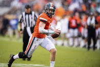 Virginia quarterback Brennan Armstrong (5) scrambles out of the pocket during the second quarter of an NCAA college football game against Duke at Scott Stadium on Saturday, Oct. 16, 2021, in Charlottesville, Va. (AP Photo/Mike Caudill)