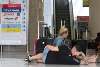 British passengers wait for news on cancelled Thomas Cook flights at Palma de Mallorca airport on Monday Sept. 23, 2019. Spain's airport operator AENA says that 46 flights have been affected by the collapse of the British tour company Thomas Cook, mostly in the Spanish Balearic and Canary archipelagos. (AP Photo/Francisco Ubilla)