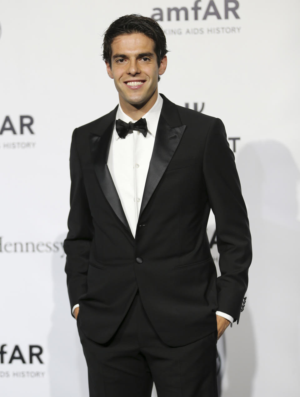 AC Milan Brazilian forward Kaka poses for photographers as he arrives for the amfAR charity dinner during the fashion week in Milan, Italy, Saturday, Sept. 21, 2013. (AP Photo/Antonio Calanni)