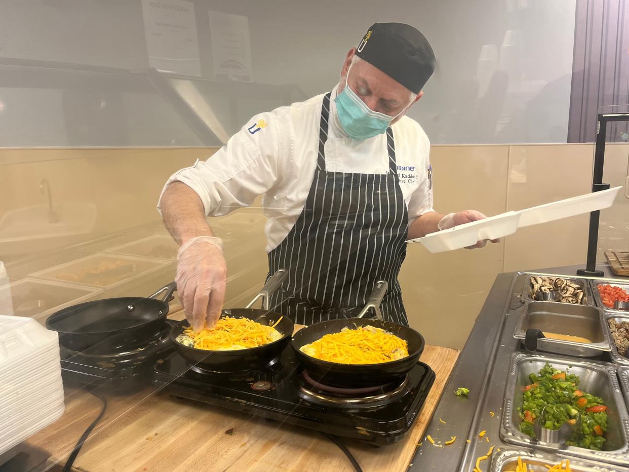 Unidine kitchen staff member Michael Kaddough makes fresh omelets for staff and visitors in the cafeteria at Portsmouth Regional Hospital.