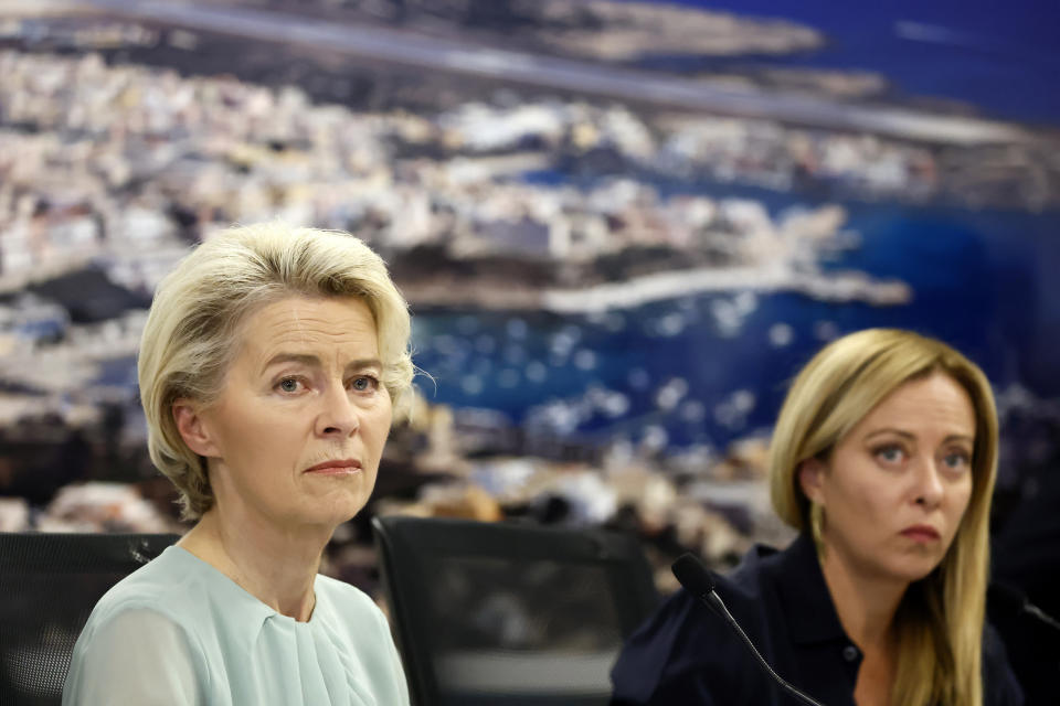 The President of the European Commission, Ursula von der Leyen, left, and Italy's Premier Giorgia Meloni, right, attend a joint press conference following a visit of the island of Lampedusa in Italy, Sunday, Sept. 17, 2023. EU Commission President Ursula von der Leyen and Italian Premier Giorgia Meloni on Sunday toured a migrant center on Italy’s southernmost island of Lampedusa that was overwhelmed with nearly 7,000 arrivals in a 24-hour period this week. (Cecilia Fabiano/LaPresse via AP)