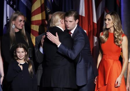 U.S. President-elect Donald Trump embraces his son Eric Trump during his election night rally in Manhattan, New York, U.S., November 9, 2016. REUTERS/Mike Segar