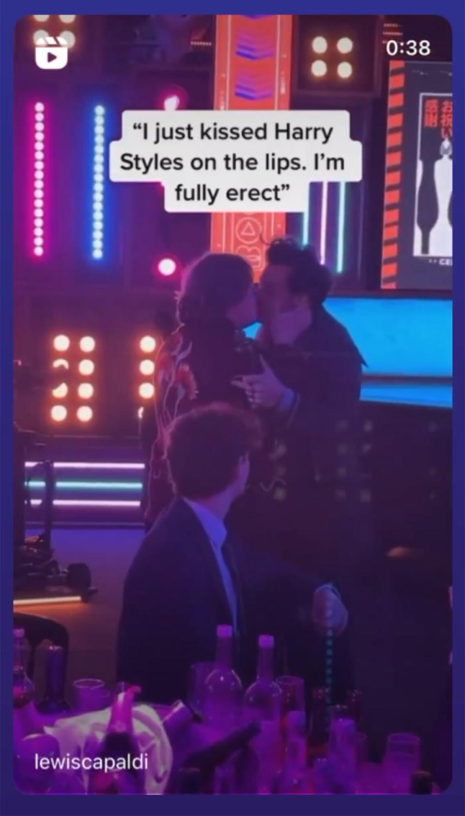 Harry Styles and Lewis Capaldi kiss at The BRIT Awards 2023 at The O2 Arena on February 11, 2023 in London