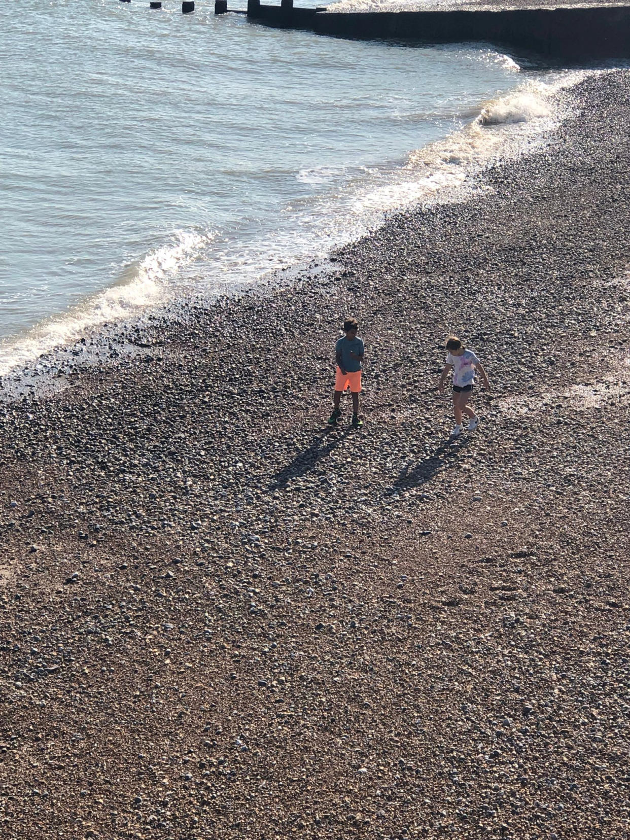 Oliver Quarte with a friend on the beach near Hastings before the incident (SWNS)