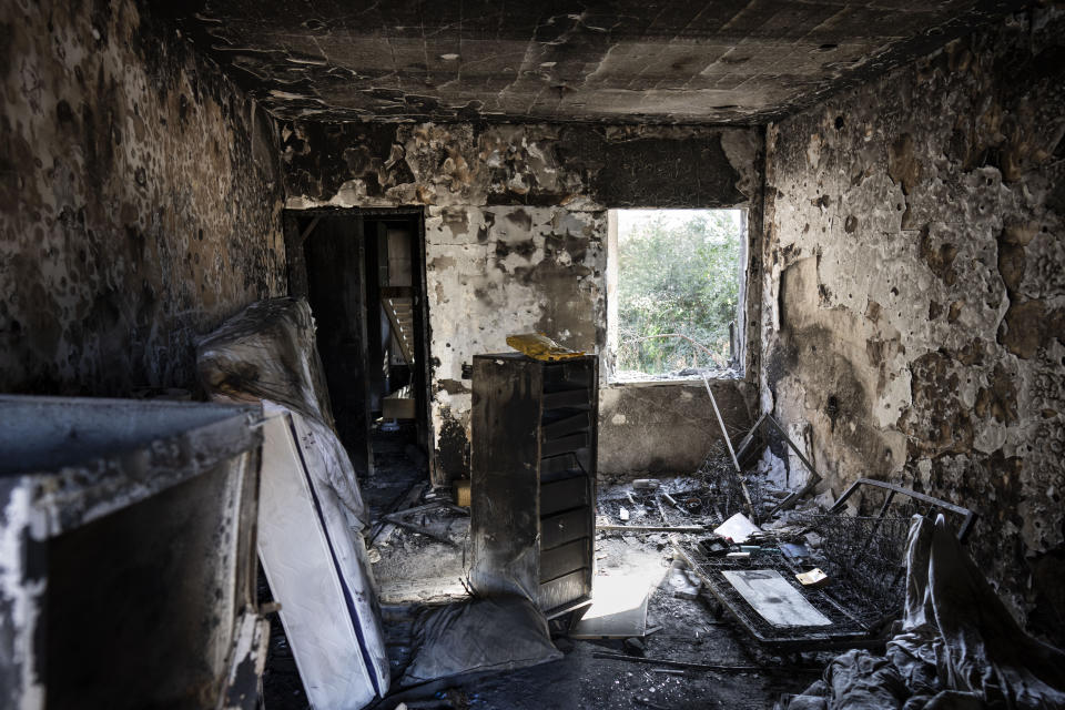 View of a destroyed house in the Kfar Azza kibbutz, Israel, near the Gaza Strip, Tuesday, Nov. 7, 2023. The kibbutz was attacked during the Hamas cross-border attack on Oct. 7, killing and capturing members of its community. (AP Photo/Bernat Armangue)