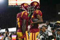 Southern California wide receiver Mario Williams (4) and wide receiver Dorian Singer (15) celebrate after a touchdown during the first half of an NCAA college football game against Stanford in Los Angeles, Saturday, Sept. 9, 2023. (AP Photo/Ashley Landis)