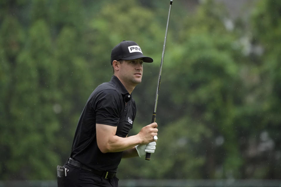 Taylor Moore watches his drive off the ninth tee during the final round of the Rocket Mortgage Classic golf tournament at Detroit Country Club, Sunday, July 2, 2023, in Detroit. (AP Photo/Carlos Osorio)