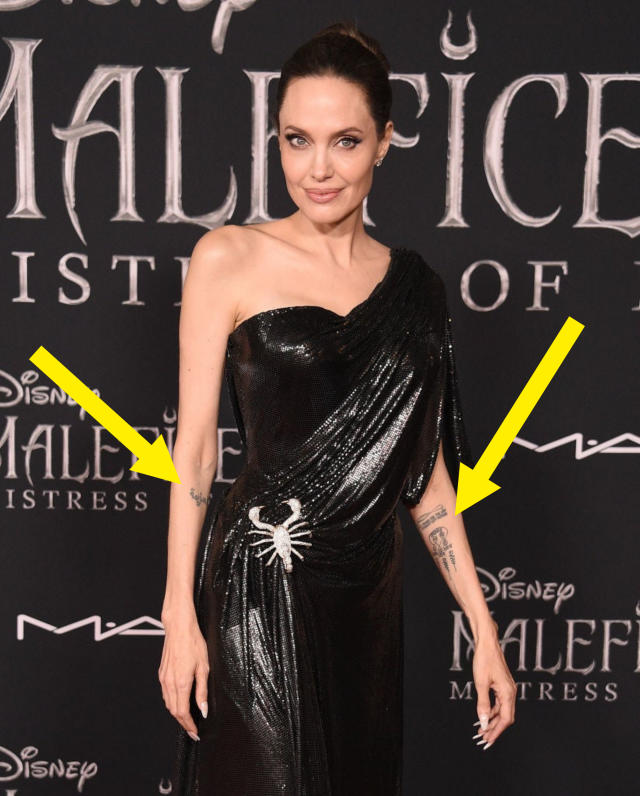 Angelina Jolie debuts middle finger tattoos with mystery message – NBC  Boston