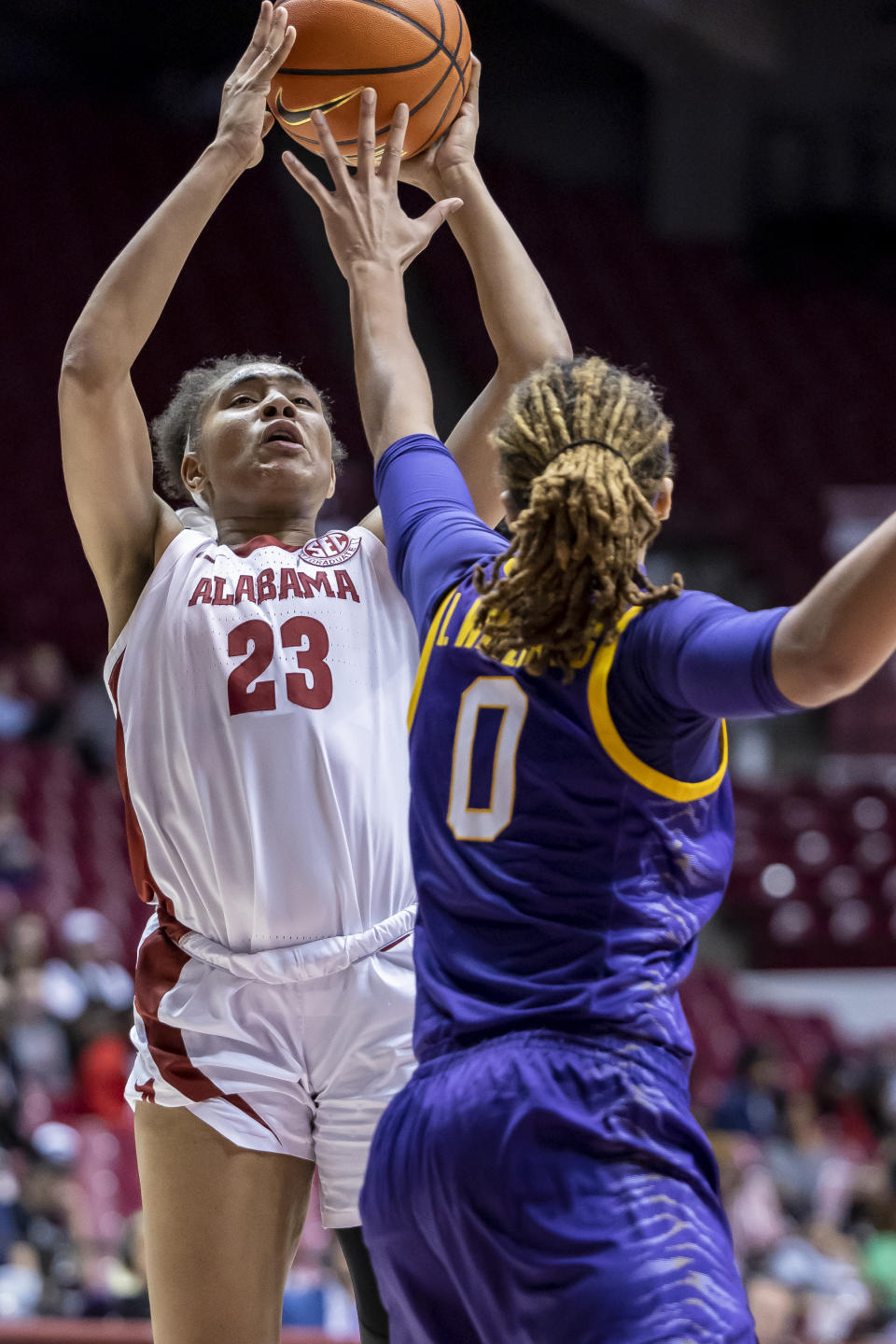 Alabama guard Brittany Davis (23) shoots over LSU forward LaDazhia Williams (0) during the second half of an NCAA college basketball game, Monday, Jan. 23, 2023, in Tuscaloosa, Ala. (AP Photo/Vasha Hunt)