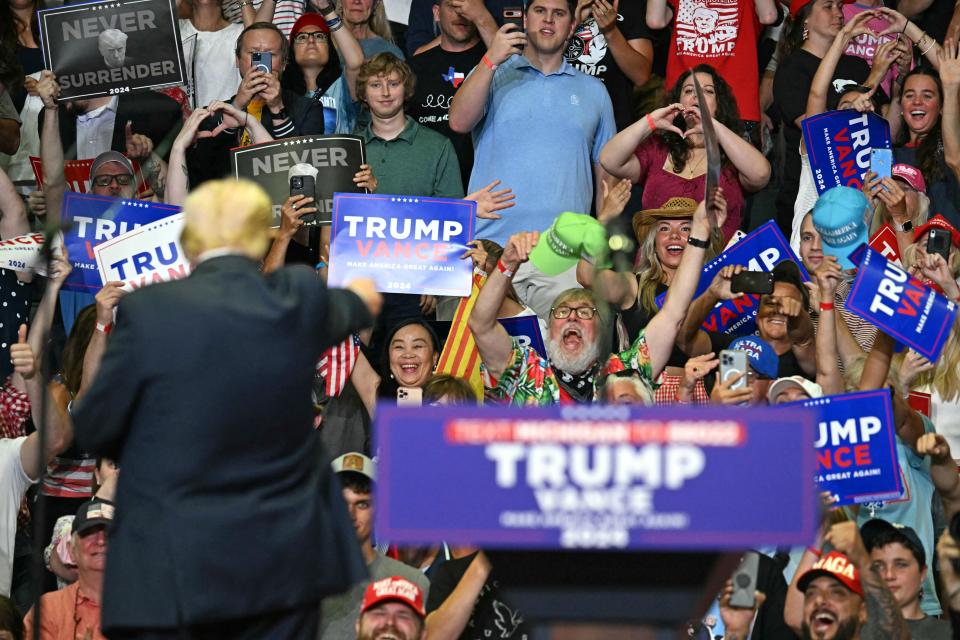 Republican presidential nominee Donald Trump gestures after speaking during a campaign rally in Michigan (AFP via Getty Images)