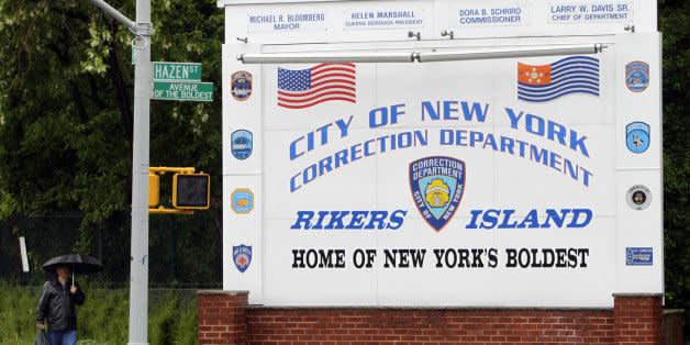 FILE - In this May 17, 2011 file photo, a man walks near the sign at the entrance to the Rikers Island jail in New York. According to a Thursday, April 3, 2014, statement by the New York City Department of Corrections, Rose Argo, the warden of the Anna M. Kross Center on Rikers Island, has been demoted and transferred to another unit that doesn't house mentally ill inmates.  In February 2014, a homeless, mentally ill veteran "baked to death" in an overheated cell at the facility. (AP Photo/Seth Wenig, File) (Photo: )