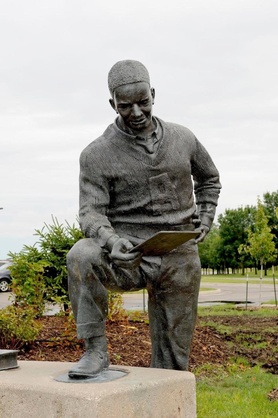 A statue of Jack Trice, Iowa State's first Black athlete, stands on the Ames campus.