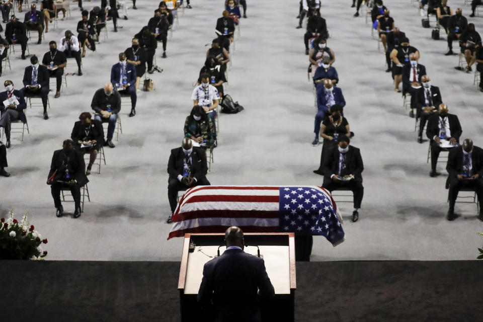 The Rev. Darryl Caldwell speaks as the casket of the late Rep. John Lewis, D-Ga., lies in repose during a service celebrating "The Boy from Troy" at Troy University on Saturday, July 25, 2020, in Troy, Ala. Lewis, who carried the struggle against racial discrimination from Southern battlegrounds of the 1960s to the halls of Congress, died Friday, July 17, 2020. (AP Photo/Brynn Anderson)