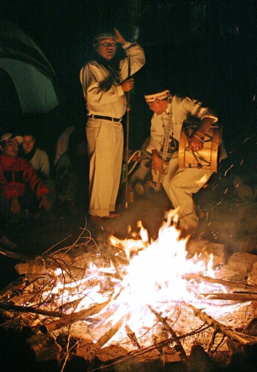 Two shamans prepare to carry out an ayahuasca ritual involving a powerful hallucinogenic concoction from the Amazon