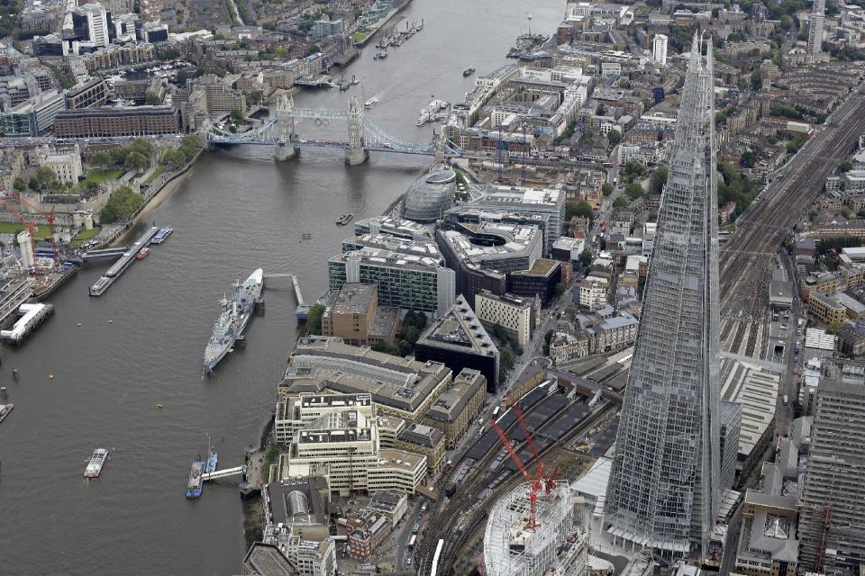 FILE - A general view of London from the air showing the newly built and opened Shard tower, right, in central London in this Friday, July, 13, 2012 file photo. Britain's tallest building, the 2012 Olympic cauldron and a non-stick ketchup bottle are among contenders for a major design award. London's Design Museum on Monday Jan 14 2013 announced nominees for its Designs of the Year prizes in seven categories including architecture, fashion, transport and digital media. (AP Photo/Alastair Grant, File )