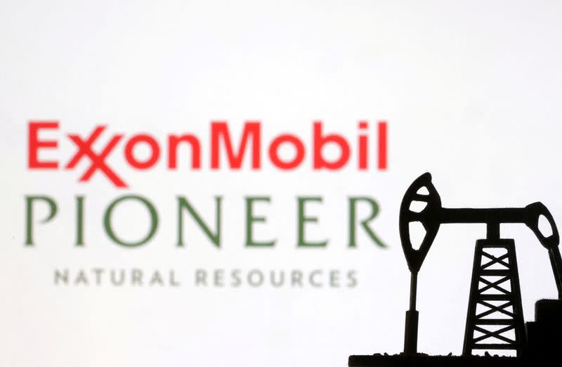 FILE PHOTO: Illustration shows ExxonMobil and Pioneer Natural Resources logos