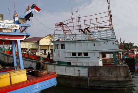A fishing boat which carried Rohingya and Bangladeshi migrants is seen at a port in Lhokseumawe, Indonesia's Aceh Province May 13, 2015. REUTERS/Roni Bintang