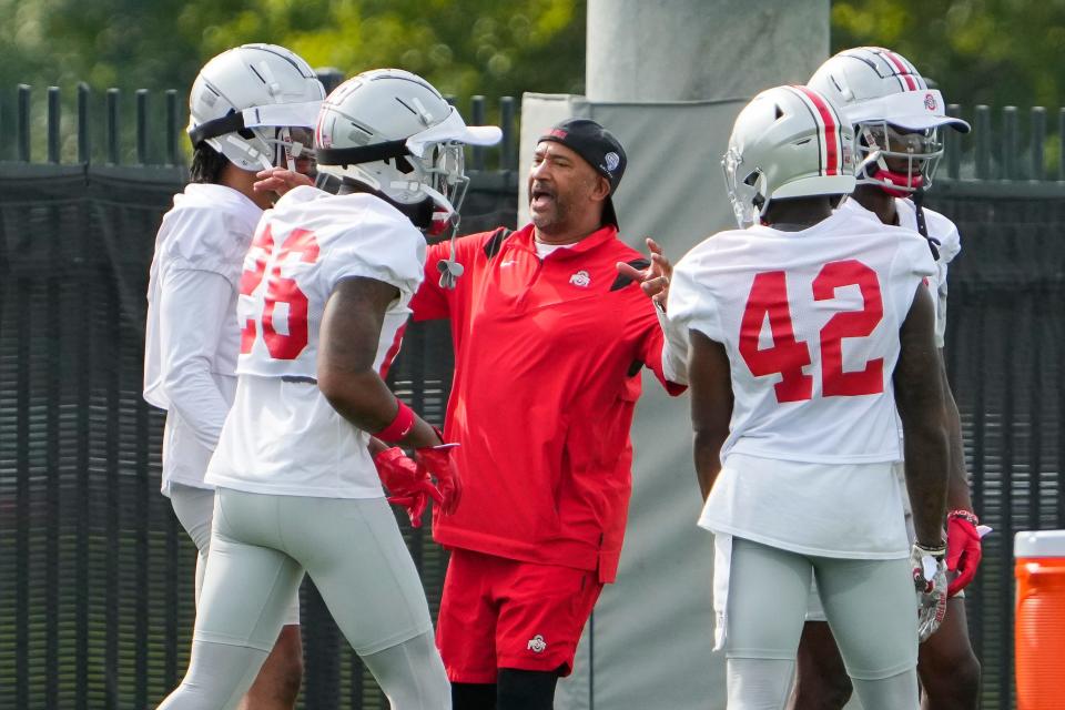Aug 4, 2022; Columbus, OH, USA;  Ohio State Buckeyes secondary coach Tim Walton leads his players in drills during the first fall football practice at the Woody Hayes Athletic Center. Mandatory Credit: Adam Cairns-The Columbus Dispatch