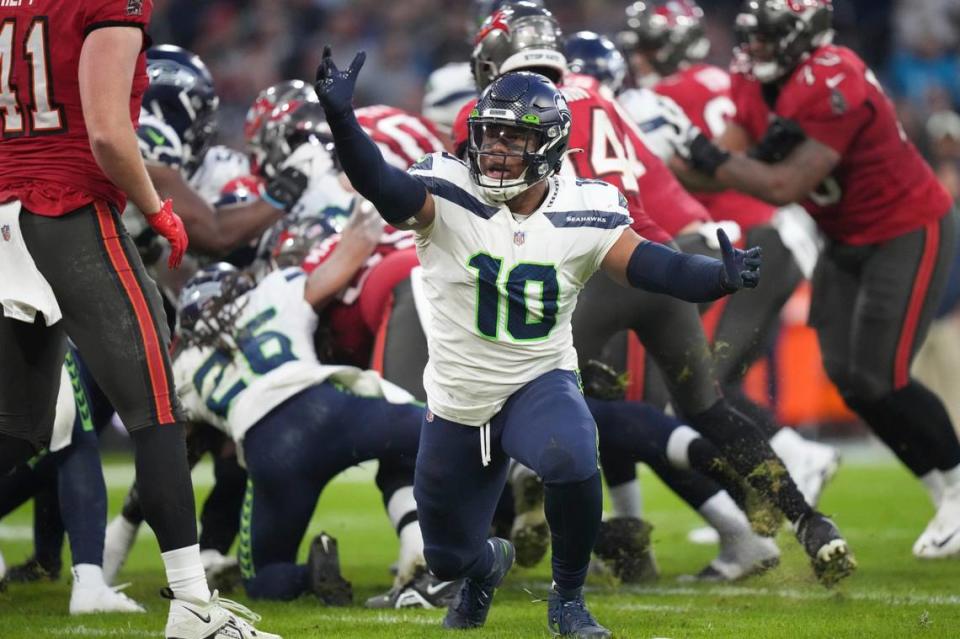 Seattle Seahawks’ Uchenna Nwosu reacts during the first half of an NFL football game against the Tampa Bay Buccaneers, Sunday, Nov. 13, 2022, in Munich, Germany. (AP Photo/Matthias Schrader)