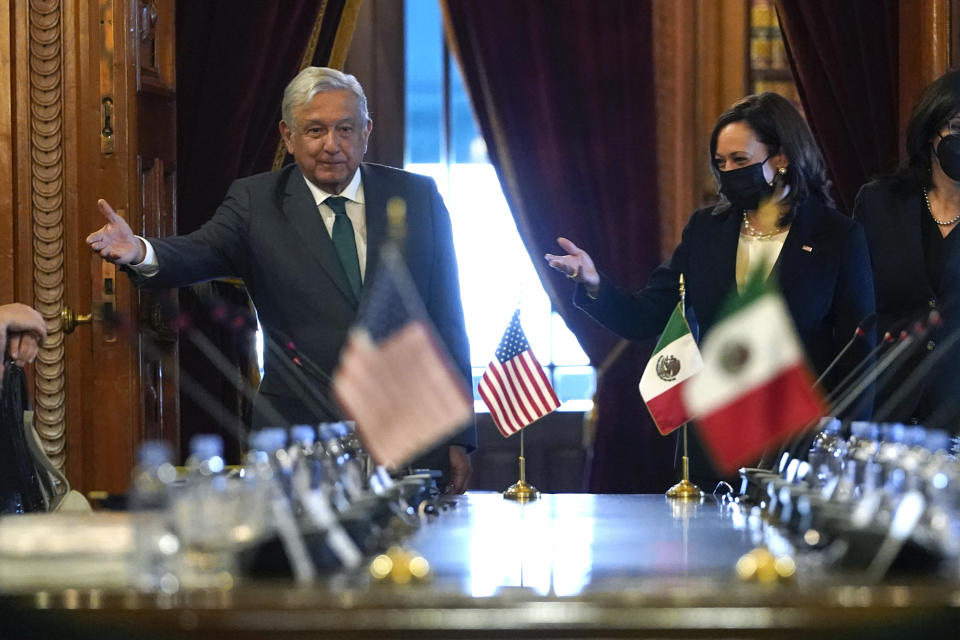 Vice President Kamala Harris and Mexican President Andres Manuel Lopez Obrador gesture as they arrive for a bilateral meeting Tuesday, June 8, 2021, at the National Palace in Mexico City. (AP Photo/Jacquelyn Martin)