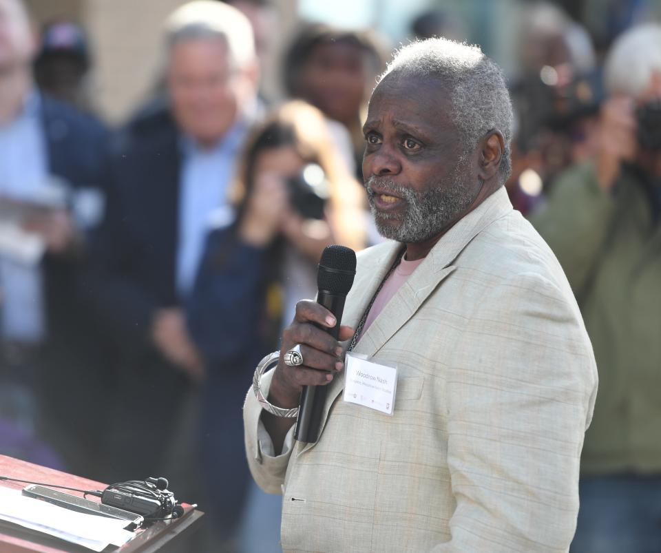 Woodrow Nash, an Akron-born sculptor and the creator of the Sojourner Truth statue in Sojourner Truth Plaza, speaks during the plaza's opening ceremony Wednesday in Akron.