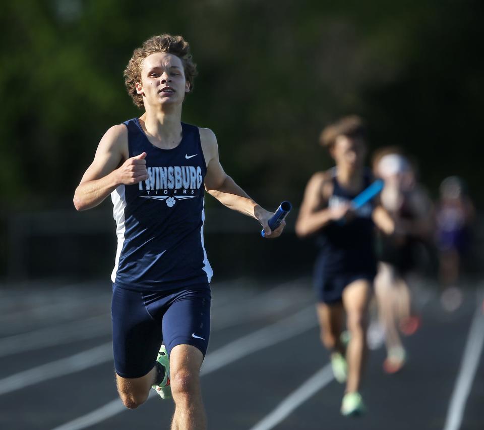 Twinsburg's Aiden Cain nears the finish line to win the boys 4x800 meter relay race with a time of 7:59.10 during the Suburban League National Conference track and field championship meet in Twinsburg on Wednesday.