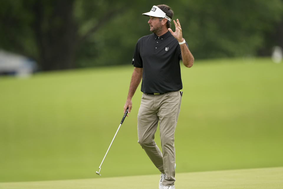 Bubba Watson waves after making a putt on the seventh hole during the third round of the PGA Championship golf tournament at Southern Hills Country Club, Saturday, May 21, 2022, in Tulsa, Okla. (AP Photo/Matt York)