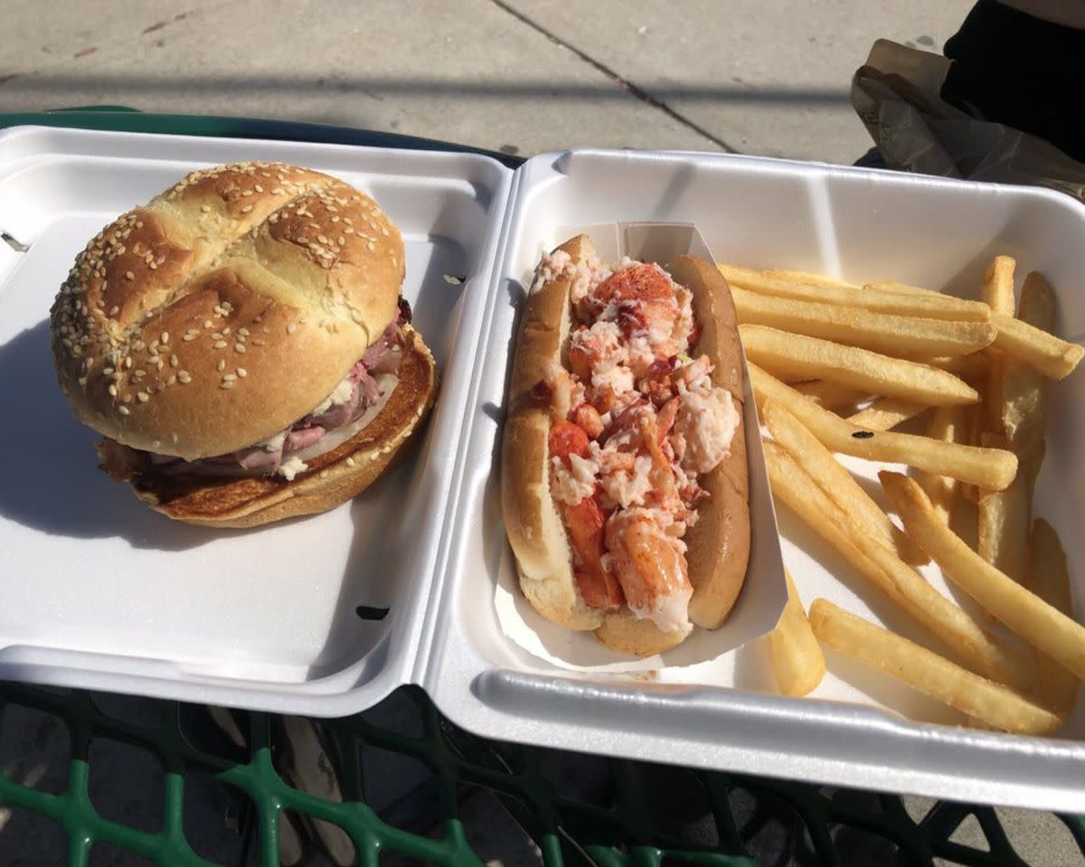 Surf and Turf which includes a Roast Beef Sandwich and a Lobster Roll with fries in a white takeout container, Kelly's Roast Beef, Revere, Massachusetts, concrete walkway in the background