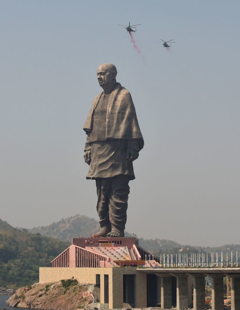 A statue of a man atop a building