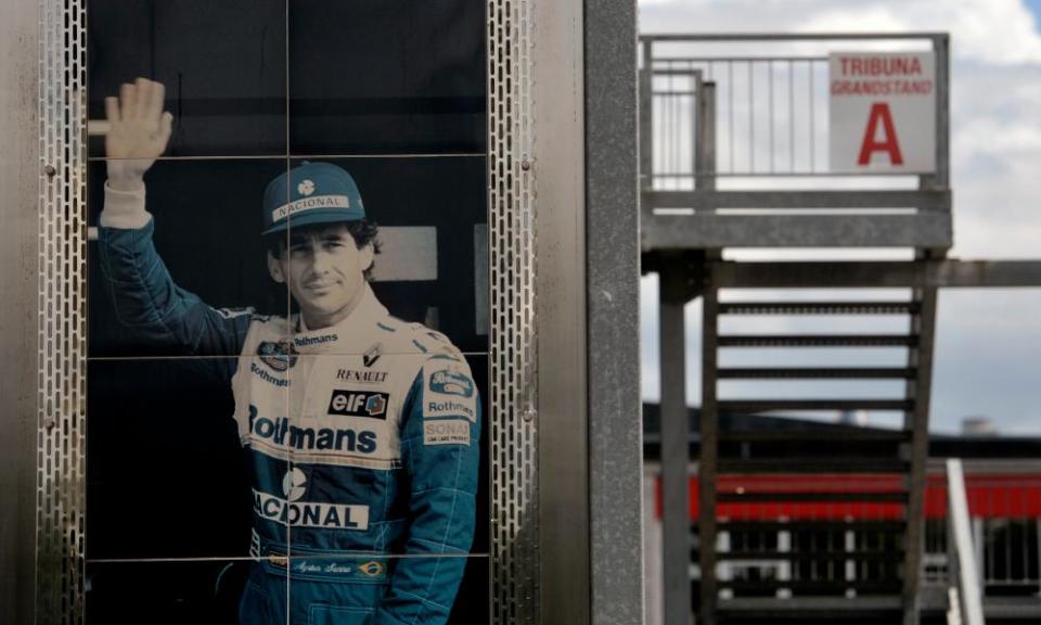 A giant poster of Ayrton Senna hangs from the tribute dedicated to him at Imola.