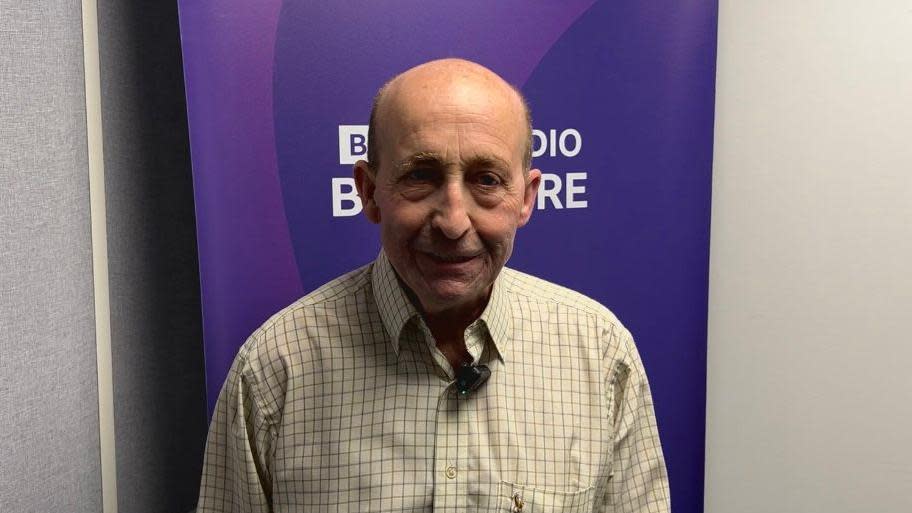 Glen Edwards stood in front of a purple BBC Radio Berkshire banner