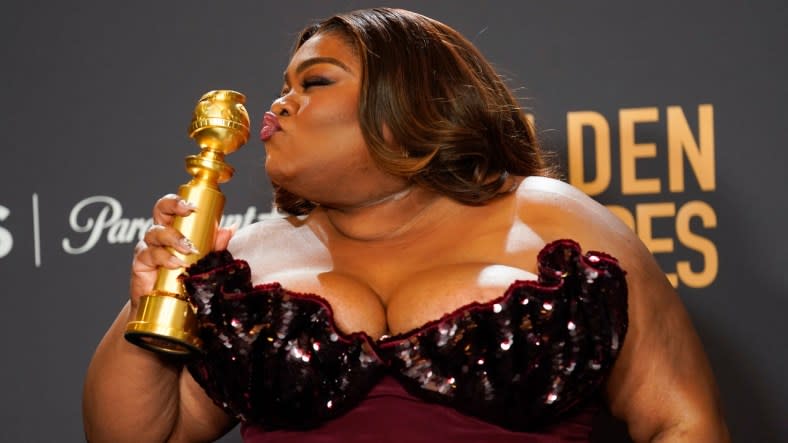 “The Holdovers” actress Da’Vine Joy Randolph poses in the press room Sunday with the award she won for best female supporting actor in a movie at the 81st Golden Globe Awards. (Photo: Chris Pizzello/AP)