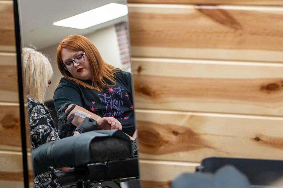 Kenzie Cox receives a Taylor Swift theme tattoo from the song “August” at The Cherry Bomb Tattoo Co. on Saturday, July 8, 2023, in Lee’s Summit. The tattoo shop is holding a Taylor Swift tattoo flash event starting from July sixth to the eighth.