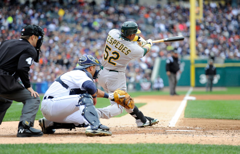 Yoenis Cespedes #52 of the Oakland Athletics hits a RBI single in the top of the third inning to drive in Cliff Pennington #2 against the Detroit Tigers during Game Two of the American League Division Series at Comerica Park on October 7, 2012 in Detroit, Michigan. (Photo by Jason Miller/Getty Images)
