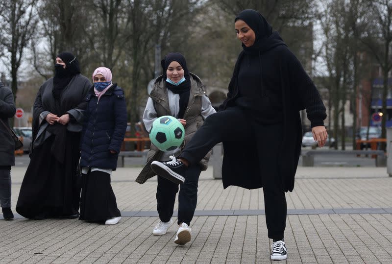 Supporters of Muslim women soccer players protest against French hijab ban in sports, in Lille