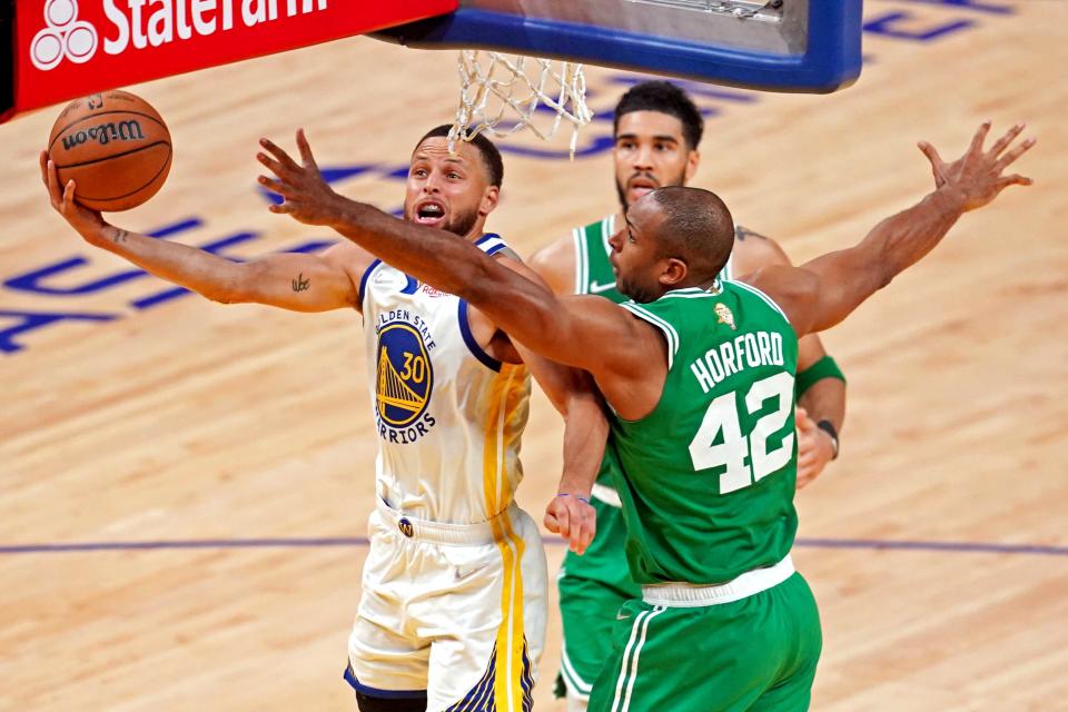 Steph Curry drives to the bucket against Al Horford during Game 2.