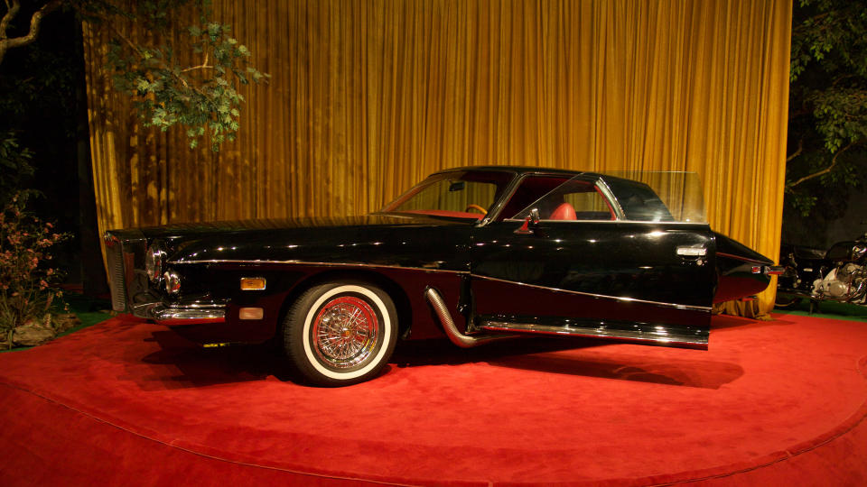 Sign on the display says: "Legend has it that this Stutz Blackhawk was originally ordered for Frank Sinatra, but [was] charmed away from the car dealer by Elvis.