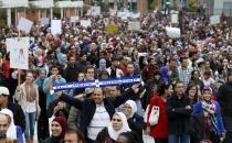 Demonstrators protest against Quebec's proposed Charter of Values in Montreal, September 14, 2013. Thousands took to the streets to denounce the province's proposed bill to ban the wearing of any overt religious garb by government paid employees. REUTERS/ Christinne Muschi(CANADA - Tags: POLITICS CIVIL UNREST RELIGION)