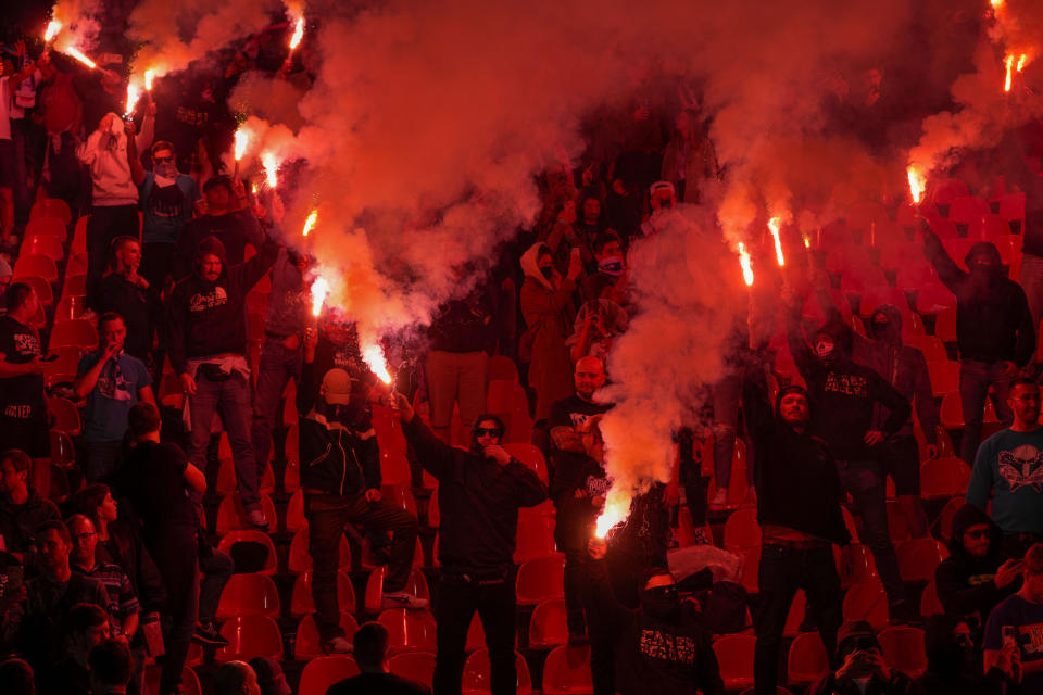 Zenit fans light fireworks during an international friendly soccer match between Red Star and Zenit St. Petersburg at the Rajko Mitic Stadium in Belgrade, Serbia, Saturday, March 23, 2024. (AP Photo/Darko Vojinovic)