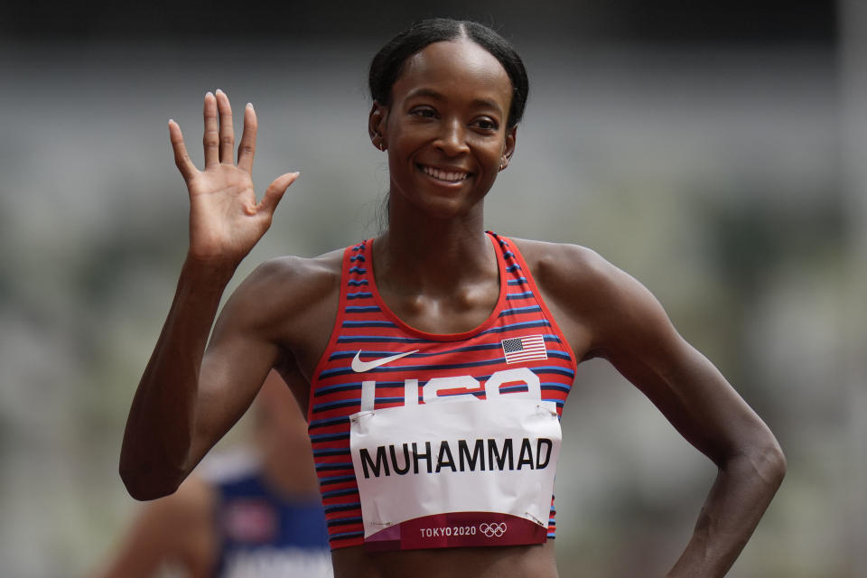 Dalilah Muhammad, of United States, reacts after winning a heat in the women's 400-meter hurdles at the 2020 Summer Olympics, Saturday, July 31, 2021, in Tokyo. (AP Photo/Petr David Josek)