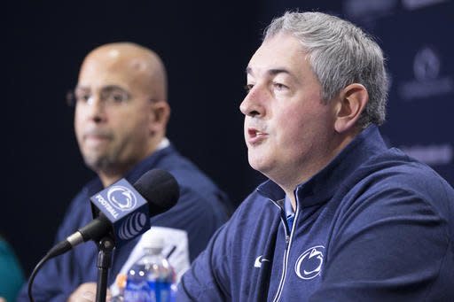 FILE - In this Dec. 16, 2015, file photo, New Penn State offensive coordinator Joe Moorhead speaks at an introductory press conference in State College, Pa., as head coach James Franklin looks on.  Moorhead's ability to deliver an offense that can help the Nittany Lions close the gap on Ohio State, Michigan and Michigan State in the Big Ten East will likely play a huge part in determining Franklin's future at Penn State.(Joe Hermitt /PennLive.com via AP, File)