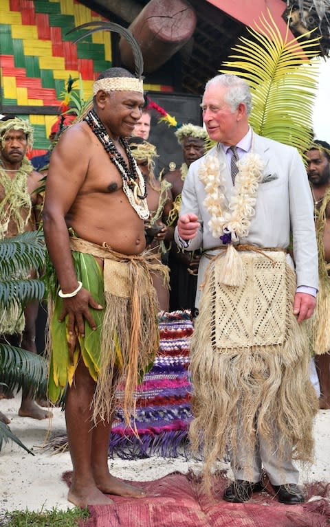 The Prince donned a grass skirt during his visit to the South Pacific Island - Credit: Tim Rooke/REX/Shutterstock