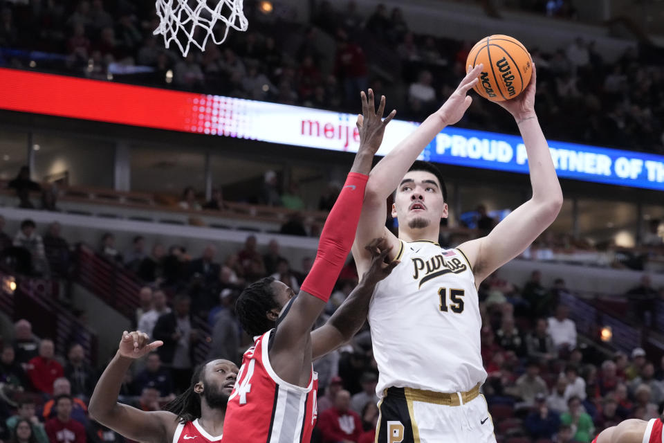 Purdue's Zach Edey (15) shoots over Ohio State's Felix Okpara (34) during the second half of an NCAA semifinal basketball game at the Big Ten men's tournament, Saturday, March 11, 2023, in Chicago. (AP Photo/Charles Rex Arbogast)