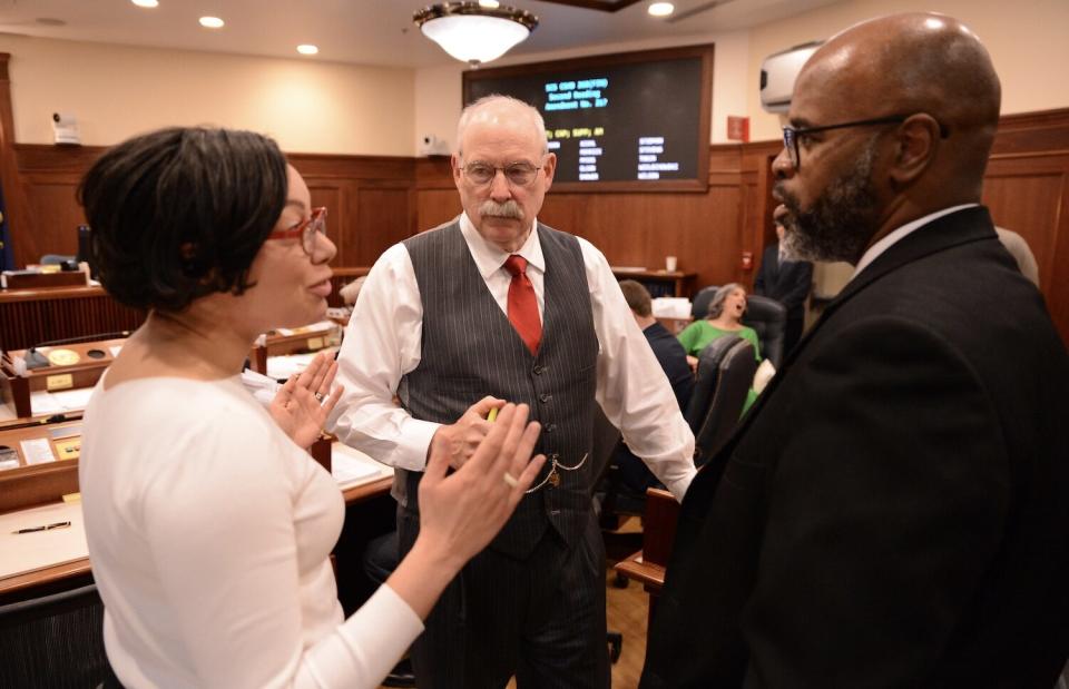 From left to right, Sens. Löki Tobin, D-Anchorage; Bert Stedman, R-Sitka; and David Wilson, R-Wasilla, discuss a proposed budget amendment on Wednesday, May 1, 2024. (Photo by James Brooks/Alaska Beacon)