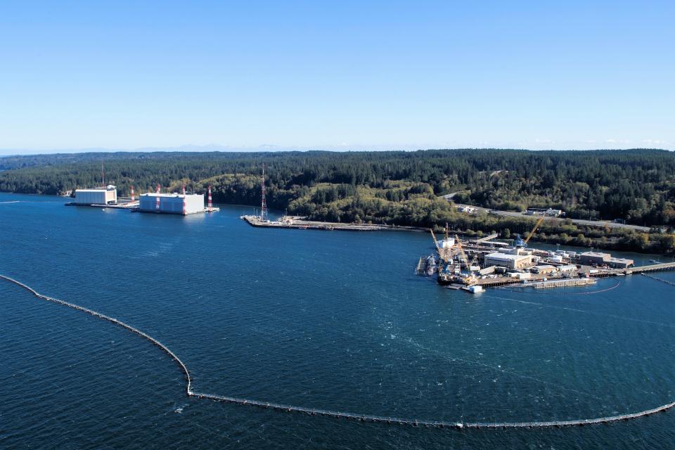 A file photo of the waterfront at Naval Base Kitsap-Bangor. The Navy said on Wednesday that the petroleum product spilled at the shoreline of Bangor between March 13 and 14 was an estimated of 11,890 gallons of oily water.