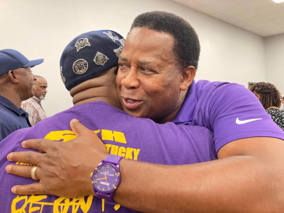 District 7 school board candidate Clyde Jackson gets a hug from a supporter after the Houston County Board of Elections reverses its decision to disqualify him June 6. Jackson went on to win the runoff election June 18.