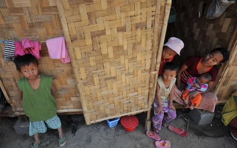  Members of an ethnic Kachin family at their shack at a refugee camp in Myitkyina, northern Myanmar, in 2012 - Credit: AFP