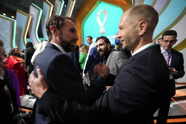 England's head coach Gareth Southgate, left, talks to United States' head coach Gregg Berhalter after the 2022 soccer World Cup draw at the Doha Exhibition and Convention Center in Doha, Qatar, Saturday, April 2, 2022. (AP Photo/Hassan Ammar)
